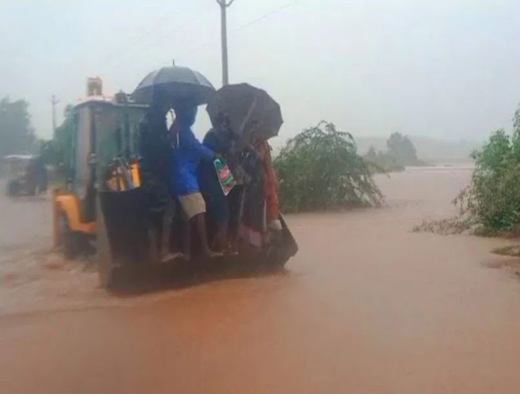 Pregnant Woman Taken Across Flooded Road On Excavator To Reach Hospital In Jagtial