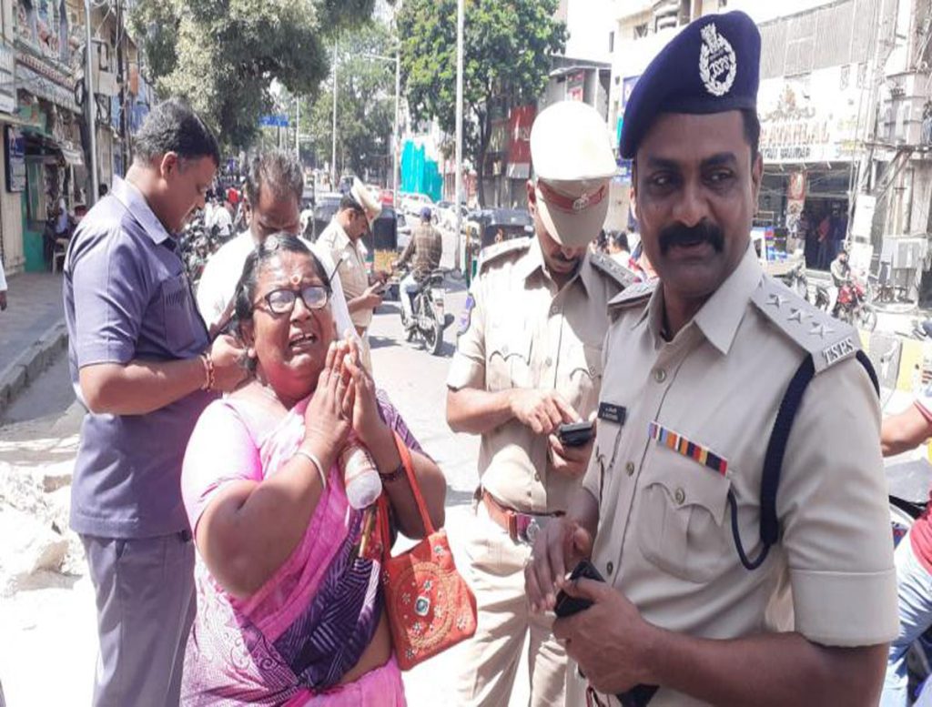 Woman Hugs Policeman on Duty in Hyderabad